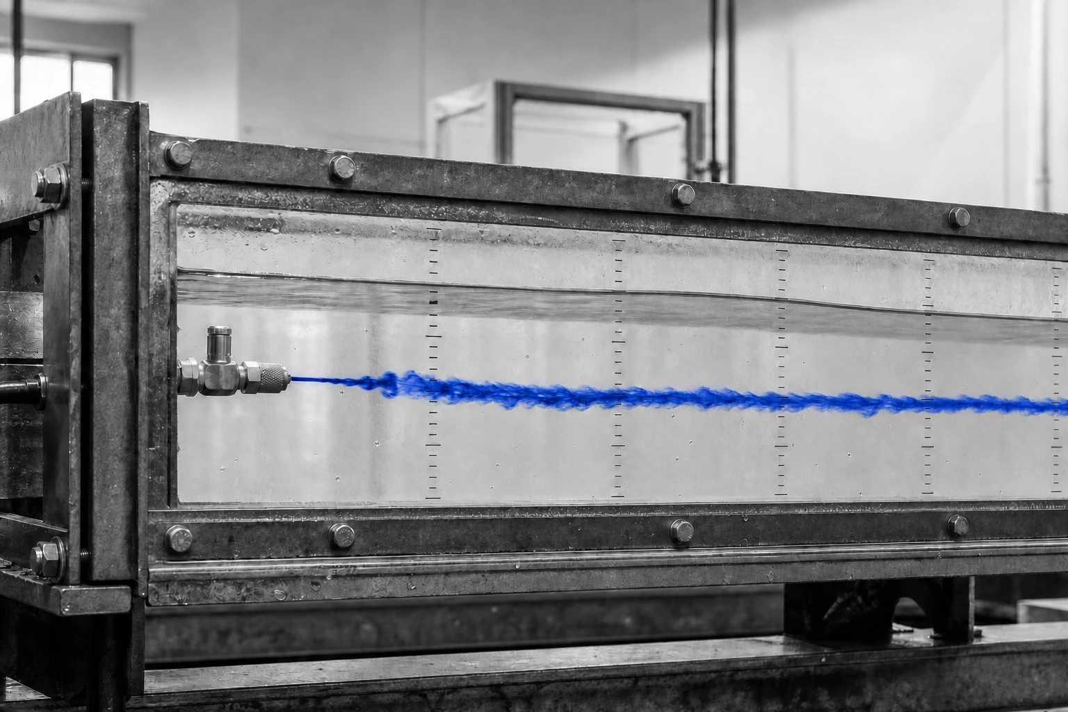 A cobalt tracer filament persisting downstream from an injection port in a measured glass water channel